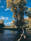 Woman Fly Fishing in Co, Holding Fish