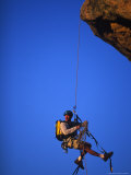 Buy Rock Climber Hanging off Cliff at AllPosters.com