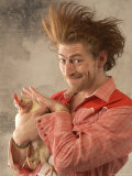 Man with Wild Hair Petting a Chicken