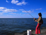 Buy Woman with Fishing Rod, Grand Haven, MI at AllPosters.com