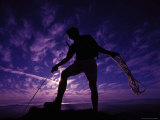 Rock Climber Outlined Against an Evening Sky