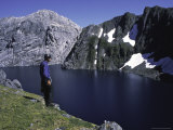 Buy A Climber Enjoying the View Over a Mountain Lake, Chile at AllPosters.com