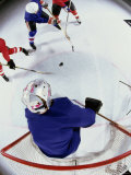 High Angle View of Ice Hockey Players Surrounding the Goal