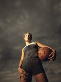 Low Angle View of a Young Woman Holding a Basketball