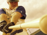 Low Angle View of a Baseball Player Swinging a Baseball Bat