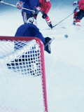 High Angle View of Ice Hockey Players Surrounding the Goal