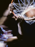 High Angle View of a Man Slam Dunking