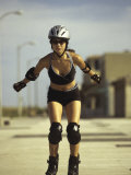 Portrait of a Young Woman Inline Skating on Road
