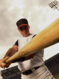 Low Angle View of a Baseball Player Swinging a Baseball Bat