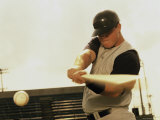 Low Angle View of a Baseball Player Swinging a Baseball Bat