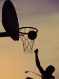 Silhouette of a Young Man Playing Basketball