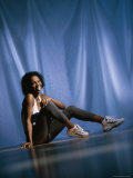 Young Woman Smiling Sitting on the Floor