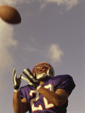 Low Angle View of an American Football Player Catching a Ball