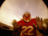 Low Angle View of an American Football Player in a Tackle Pose