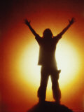 Victorious Climber Silhouetted by the Sun