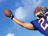 Low Angle View of an American Football Player Catching a Ball