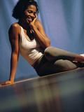 Young Woman Sitting on the Floor Smiling