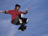 Buy Young Man Jumping in Mid Air Wearing Inline Skates at AllPosters.com