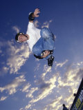Rollerblader Perfoming Trick on Ramp