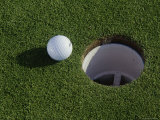 Close-up of a Golf Ball Near a Hole