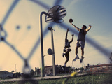 Low Angle View of Two Men Playing Basketball