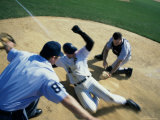 Baseball Player Sliding into Home Base