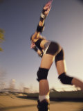 Buy Low Angle View of a Young Woman Skating at AllPosters.com