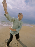 Buy Senior Man Practicing Tai Chi on the Beach at AllPosters.com