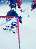 High Angle View of Ice Hockey Players Surrounding The Goal
