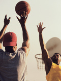 Low Angle View of Two Men Playing Basketball