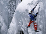 Man Climbing a Rock