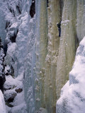 Man Climbing the Side of a Mountain