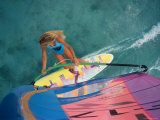 Buy High Angle View of a Young Woman Windsurfing at AllPosters.com