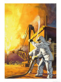 Fireman in Safety Suit Fighting a Fire at an Oil Field