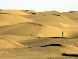A Visitor Stands on Sand Dune in the Taklimakan Desert Photographic Print
