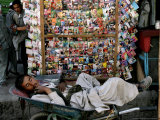 Buy A Casual Labourer Rests, Downtown Kabul, Afghanistan, During the Afghan Weekend, June 2, 2006 at AllPosters.com