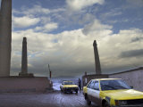 Buy Taxis Pass a Guard in Herat, Afghanistan, in This December 7, 2001 Photo at AllPosters.com