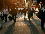 Buy Japanese Commuters Walk Through a Tokyo Street on Their Way to the Train Stations at AllPosters.com