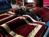 Buy A Masked Boy Rests at a Carpet Shop in Kabul, Afghanistan, Friday, September 22, 2006 at AllPosters.com