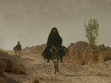 A Woman Rides a Donkey in Bamiyan Province, Central Afghanistan, September 16, 2005