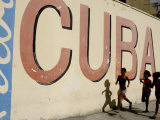 Cuban Girls Run in a Street in Havana, Cuba, Thursday, August 10, 2006