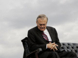 Outgoing Secretary of Defense Donald Rumsfeld Looks Down as He Sits on Stage