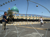 Iraqi Children Play Soccer on a Deserted Street