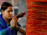 Buy A Woman Offers Prayers to a Banyan Tree Covered by Sacred Thread at AllPosters.com