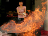Buy A Woman Prepares to Burn Hell Money at AllPosters.com