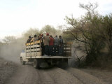 Buy A Group of Men Look on as Their Truck is Stuck in Dirt Tracks at AllPosters.com
