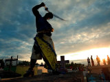 Dominican People Disguised as Cachuas Fight with Whips Over the Tombs