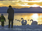 A Mother and Child Feed Water Fowl on the Ice Covered Shores of Lake Chiemsee
