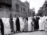 Pathan Women Observe Strict Muslim Purdah as They Come out to Vote at a High School