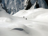 Two Mountain Hikers are Dwarfed by the Winter Landscape of the Formazza Valley